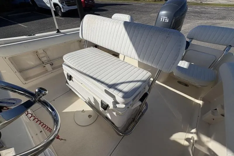 Slide: The Image of 2004 Key West 186 Sportsman boat interior with seating and Yamaha 115 engine. - 12