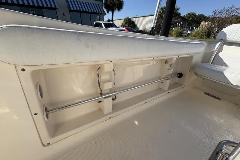 Slide: The Image of 2004 Key West 186 Sportsman boat interior with storage compartment and seating. - 13