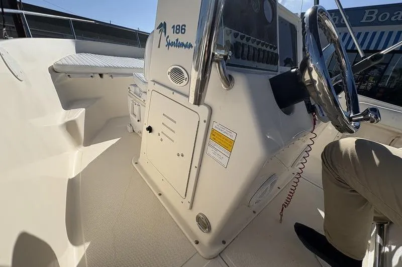 Slide: The Image of 2004 Key West 186 Sportsman boat interior with steering console and seating area. - 20
