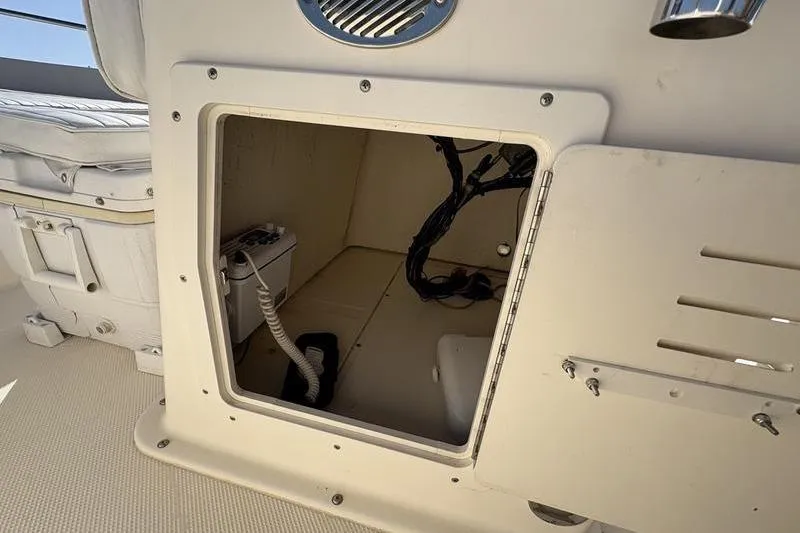 Slide: The Image of Open storage compartment on a 2004 Key West 186 Sportsman boat. - 21