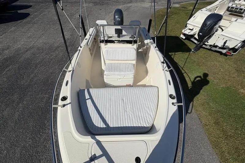 Slide: The Image of 2004 Key West 186 Sportsman boat with cushioned seating and Yamaha outboard motor. - 24