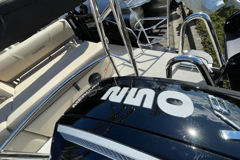 Slide: The Image of 2026 Harris Cruiser 250 boat with Mercury engine, featuring sleek design and comfortable seating. - 7