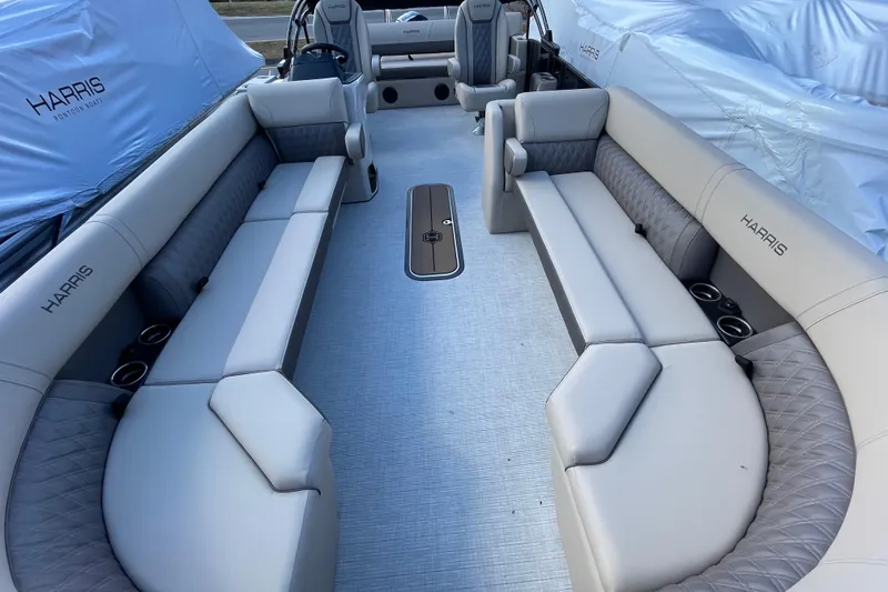 Slide: The Image of 2026 Harris Cruiser 250 pontoon boat interior with spacious seating and modern design. - 9