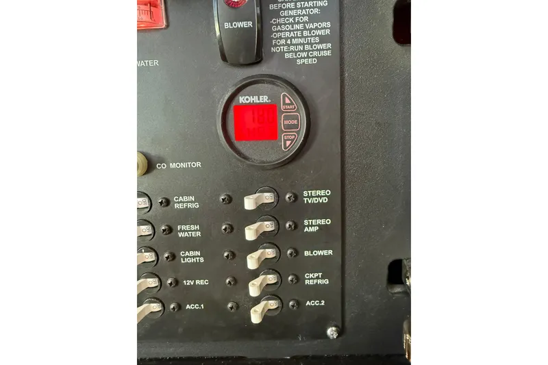 Slide: The Image of Control panel of a 2019 Boston Whaler 315 Conquest boat with Kohler generator display. - 11