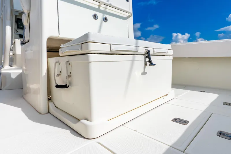 Slide: The Image of 2016 SeaVee 340Z boat deck with storage compartment under clear blue sky. - 12