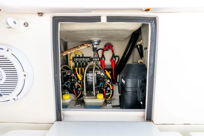 Slide: The Image of 2016 SeaVee 340Z electrical compartment with wiring and components. - 13