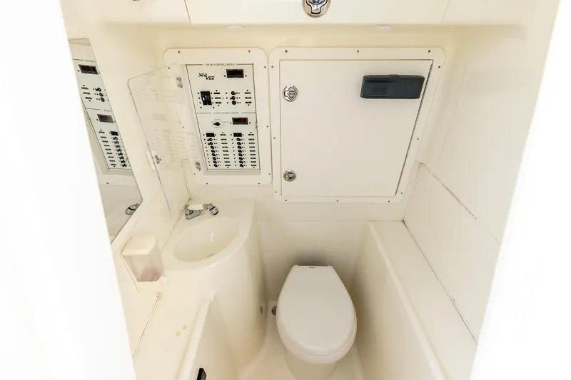 Slide: The Image of Compact bathroom in 2016 SeaVee 340Z boat with control panel and toilet. - 20