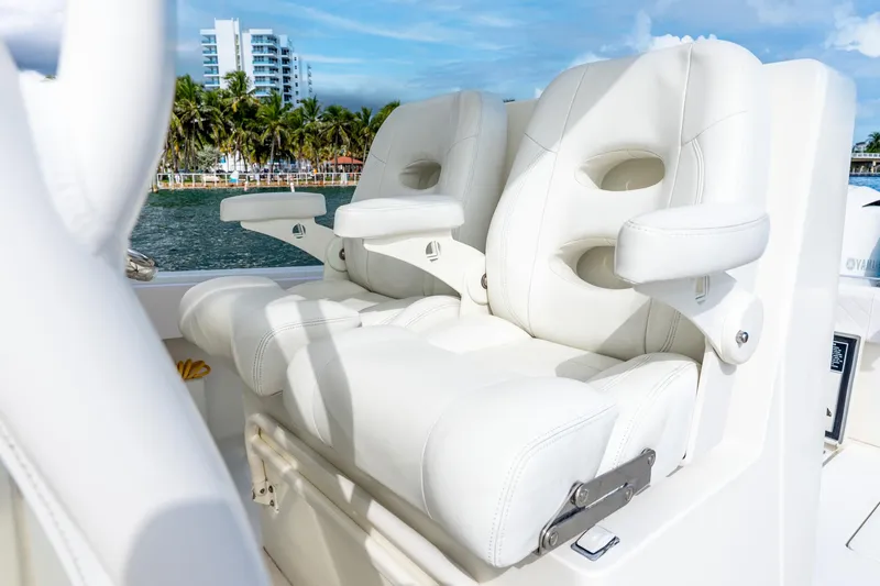 Slide: The Image of 2016 SeaVee 340Z boat with luxurious white leather seats, ocean view background. - 32