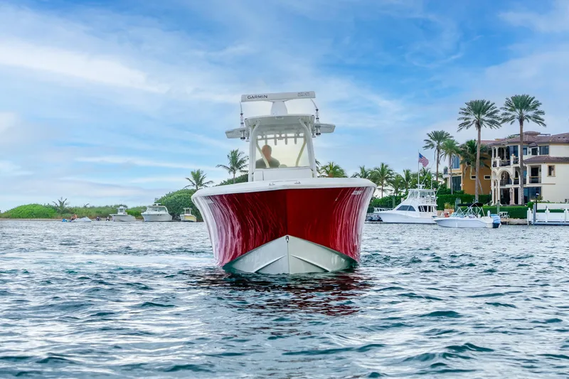 Slide: The Image of 2016 SeaVee 340Z boat on water near luxury waterfront homes. - 4