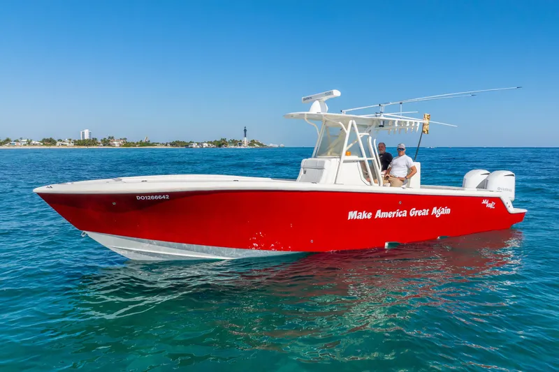Slide: The Image of 2016 SeaVee 340Z boat in vibrant red on clear blue water. - 40