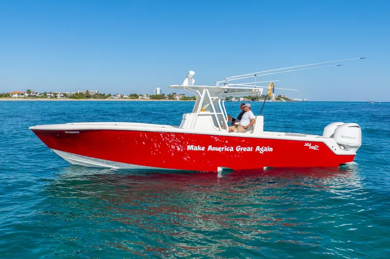 Slide: The Image of 2016 SeaVee 340Z boat with "Make America Great Again" slogan, cruising on clear blue water. - 41