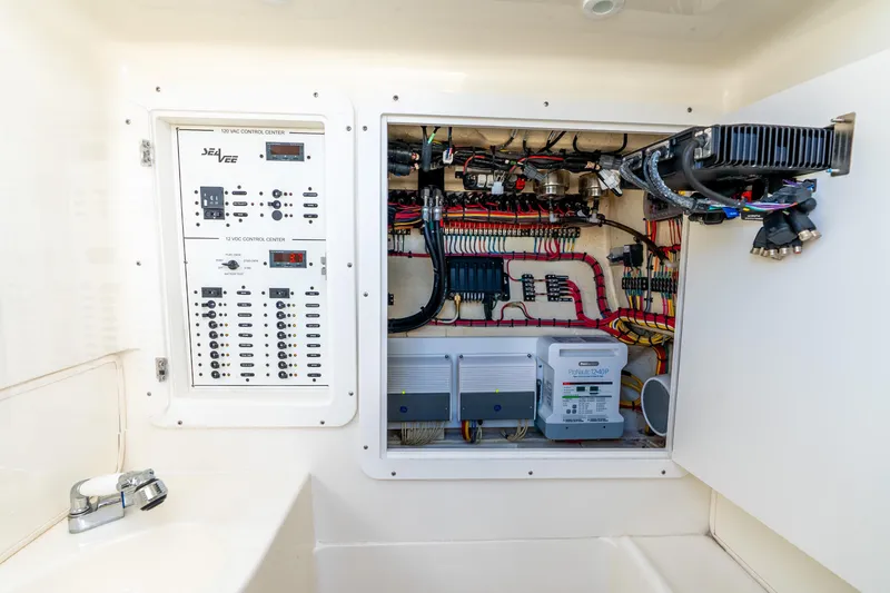 Slide: The Image of Electrical control panel of a 2016 SeaVee 340Z boat, showcasing wiring and components. - 5