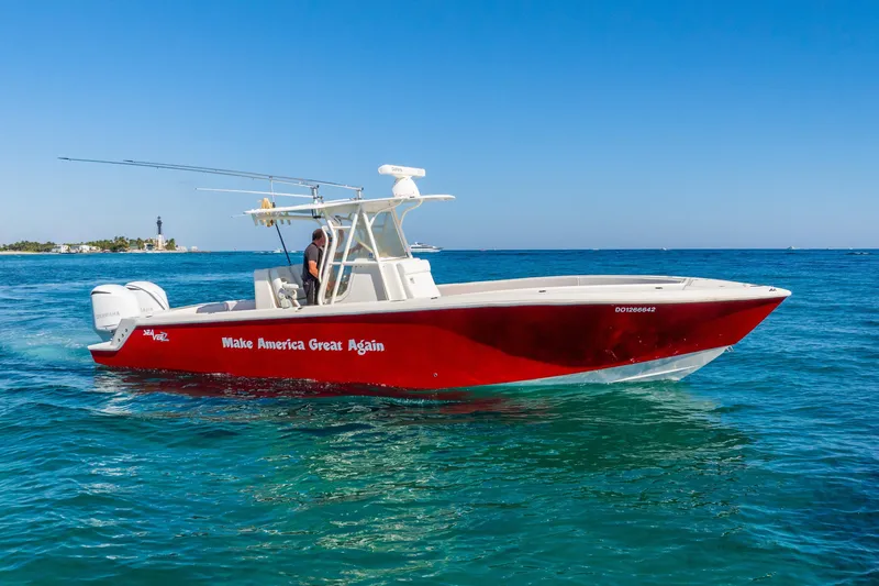 Slide: The Image of 2016 SeaVee 340Z boat with "Make America Great Again" slogan, cruising on clear blue waters. - 50