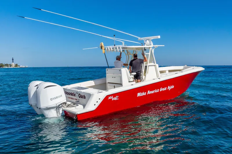 Slide: The Image of 2016 SeaVee 340Z boat with Yamaha engines on blue ocean water. - 52