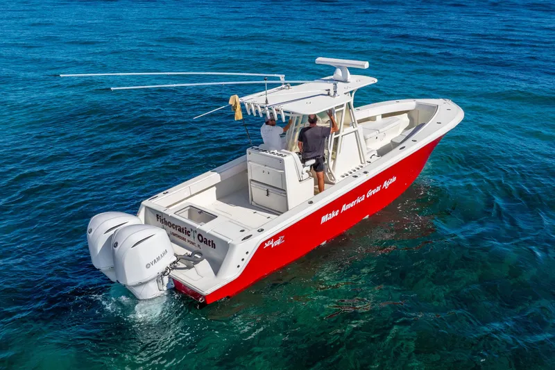 Slide: The Image of 2016 SeaVee 340Z boat with dual Yamaha engines on clear blue water. - 53