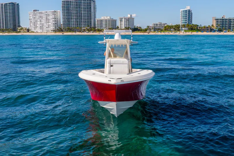 Slide: The Image of 2016 SeaVee 340Z boat on blue ocean, city skyline in background. - 54