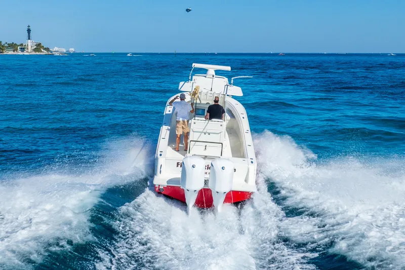 Slide: The Image of 2016 SeaVee 340Z boat cruising on open blue ocean waters. - 55