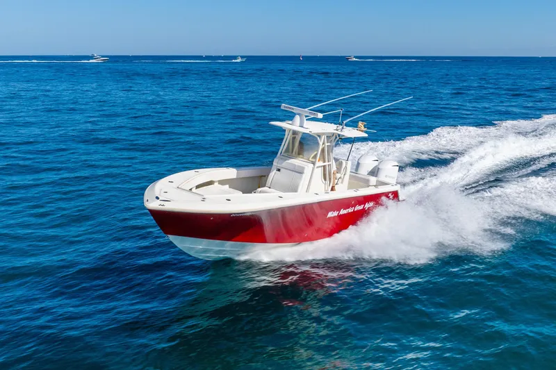 Slide: The Image of 2016 SeaVee 340Z boat cruising on open blue ocean waters. - 61