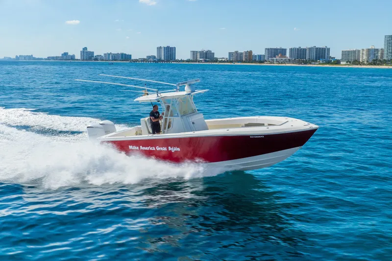 Slide: The Image of 2016 SeaVee 340Z boat cruising on ocean near city skyline. - 62