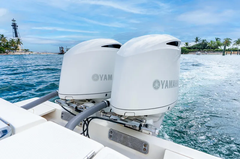 Slide: The Image of 2016 SeaVee 340Z boat with dual Yamaha outboard engines on the ocean. - 7