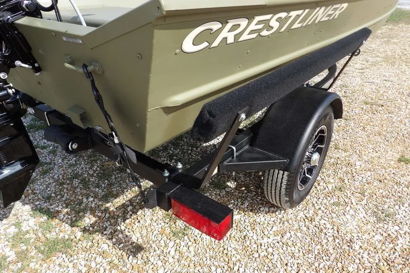 Slide: The Image of 2026 Crestliner 1648M CR Jon boat on trailer, rear view, gravel background. - 18