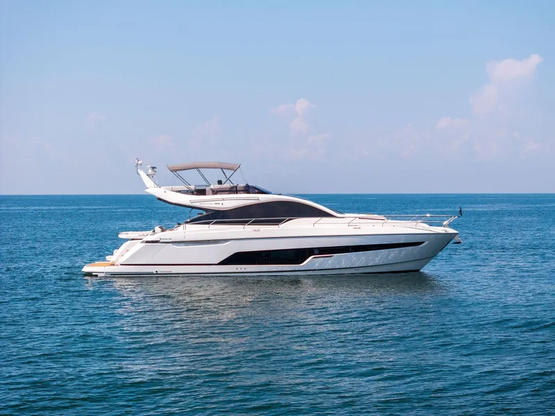 The Image of 2024 Fairline Phantom 65 yacht cruising on open water, creating a dynamic wake. - 0