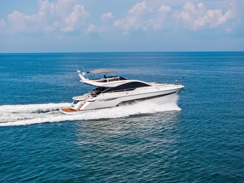 Slide: The Image of 2024 Fairline Phantom 65 yacht on calm water, side view. - 1