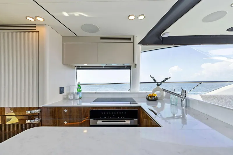 Slide: The Image of 2024 Fairline Phantom 65 yacht cockpit with modern steering and luxurious seating. - 16