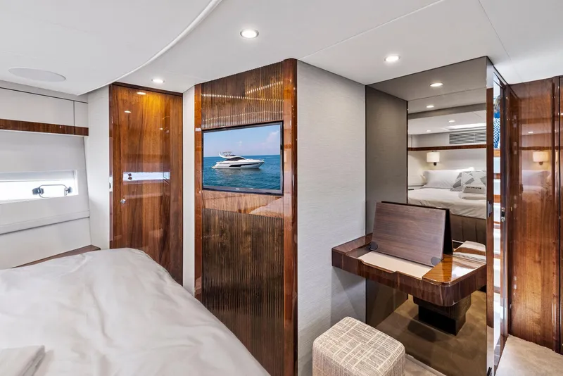 Slide: The Image of Luxurious bedroom interior of 2024 Fairline Phantom 65 yacht with modern design and elegant furnishings. - 33