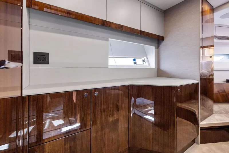 Slide: The Image of Luxurious interior of 2024 Fairline Phantom 65 yacht with elegant wood finish and modern design. - 37