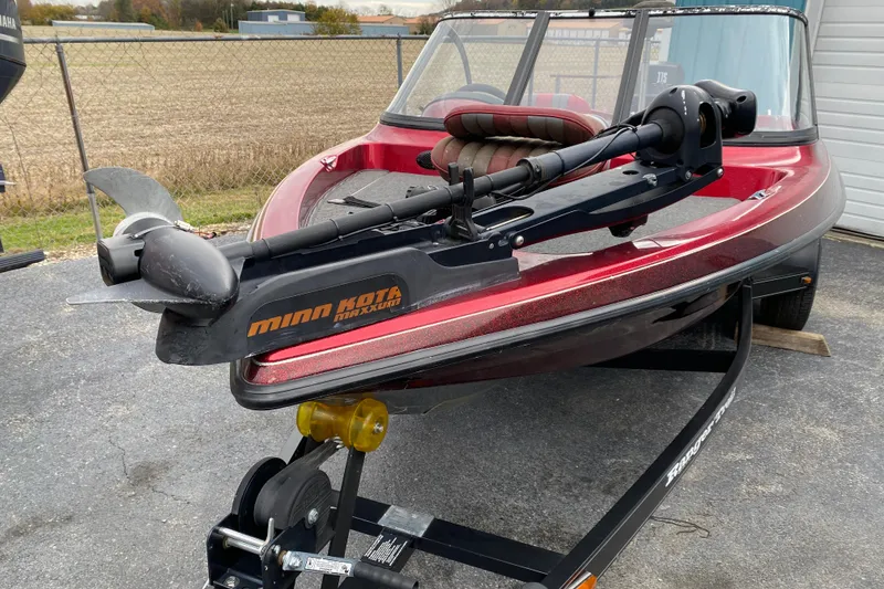 Slide: The Image of 1999 Ranger R77 Sport boat with Minn Kota trolling motor on trailer. - 11