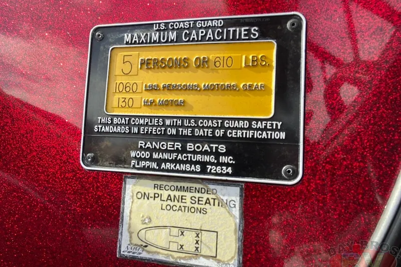 Slide: The Image of 1999 Ranger R77 Sport capacity plate, 5 persons or 610 lbs, U.S. Coast Guard compliant. - 29