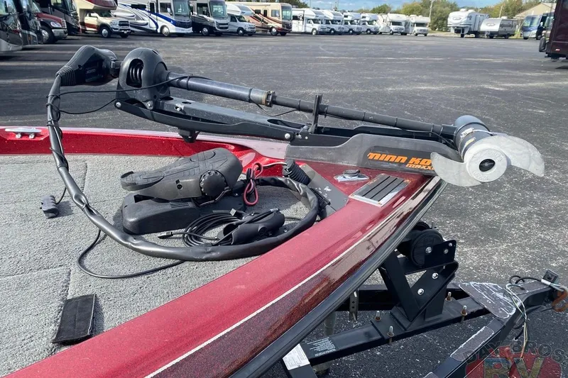 Slide: The Image of 1999 Ranger R77 Sport boat with Minn Kota trolling motor in parking lot. - 7