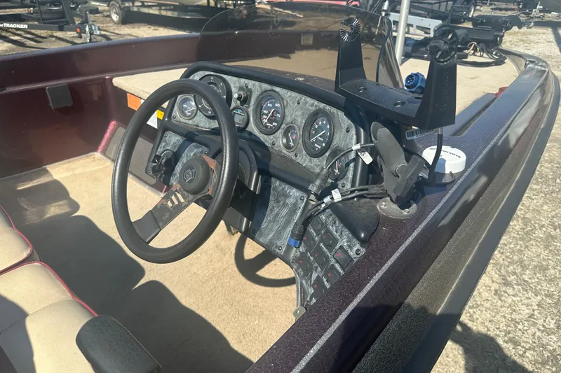 Slide: The Image of 1998 Charger 186 VF boat dashboard with steering wheel and instrument panel. - 8