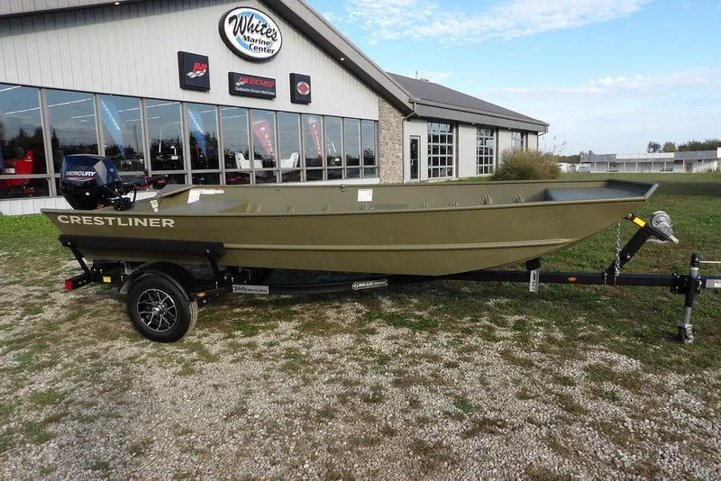 The Image of 2026 Crestliner 1648M CR Jon boat on trailer outside marine center. - 0