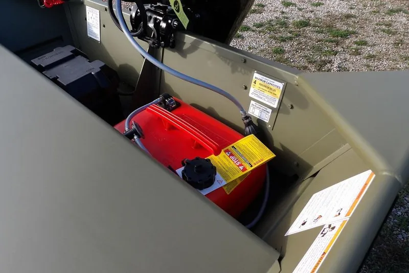 Slide: The Image of 2026 Crestliner 1648M CR Jon boat interior with fuel tank and battery. - 10