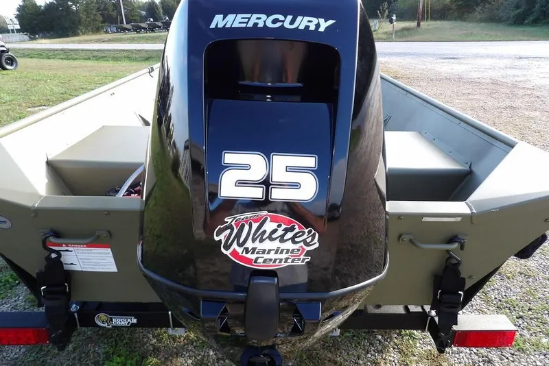 Slide: The Image of 2026 Crestliner 1648M CR Jon boat with Mercury 25 engine, parked outdoors. - 14