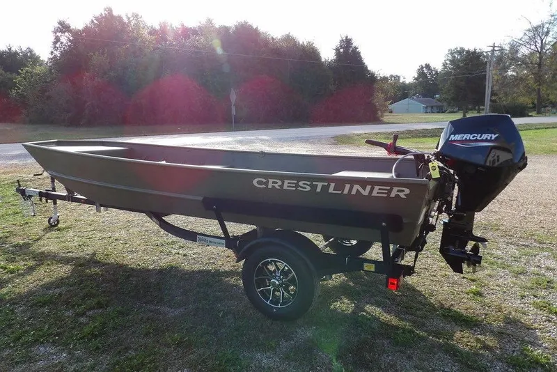 Slide: The Image of 2026 Crestliner 1648M CR Jon boat with Mercury engine on trailer, outdoors. - 4