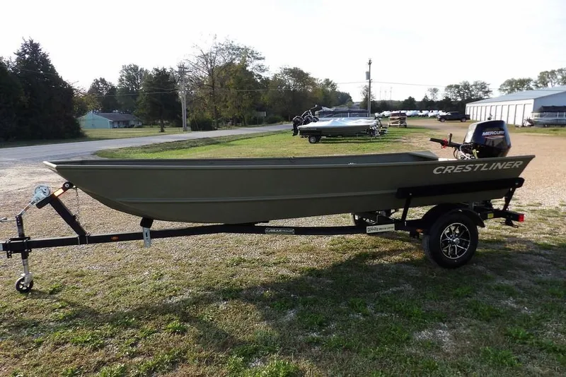 Slide: The Image of 2026 Crestliner 1648M CR Jon boat on trailer, parked outdoors. - 6