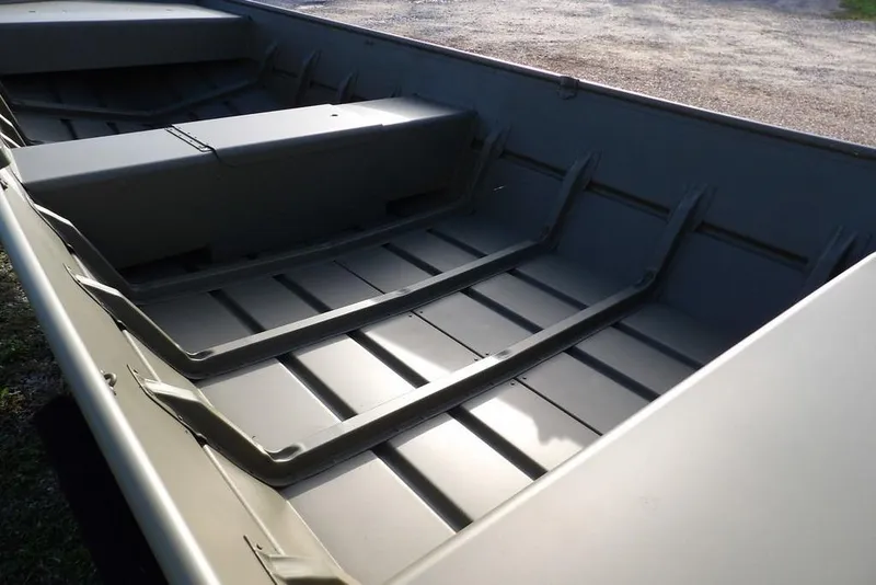 Slide: The Image of 2026 Crestliner 1648M CR Jon boat interior with durable aluminum construction. - 8
