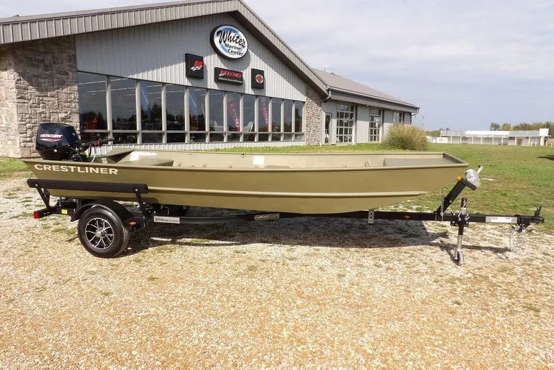 The Image of 2026 Crestliner 1648 CR Jon boat on trailer outside marine center. - 0