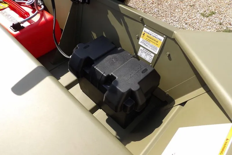 Slide: The Image of 2026 Crestliner 1648 CR Jon boat interior with battery and fuel tank. - 12