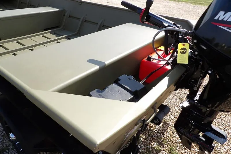 Slide: The Image of 2026 Crestliner 1648 CR Jon boat with motor and fuel tank, parked on gravel. - 13