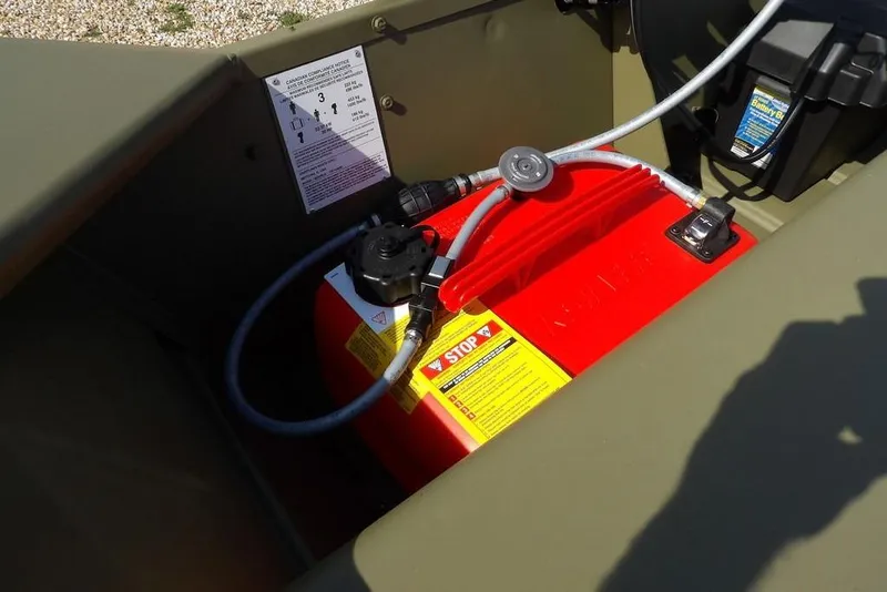 Slide: The Image of Fuel tank setup in 2026 Crestliner 1648 CR Jon boat, featuring safety instructions. - 14