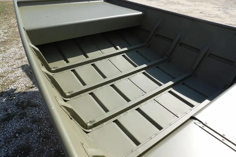 Slide: The Image of 2026 Crestliner 1648 CR Jon boat interior with durable, ribbed aluminum flooring. - 15