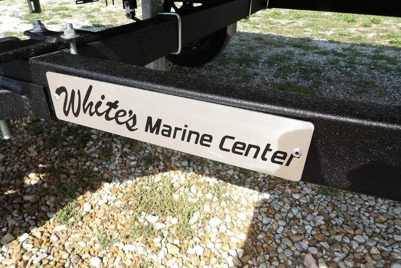 Slide: The Image of White's Marine Center sign on Crestliner 1648 CR Jon trailer, 2026 model. - 16