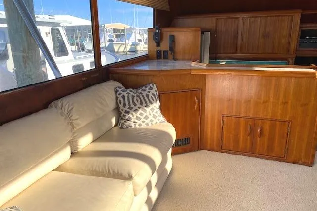 Slide: The Image of Interior of 1988 Buddy Davis 47 Custom Carolina yacht with beige sofa and wooden cabinetry. - 13