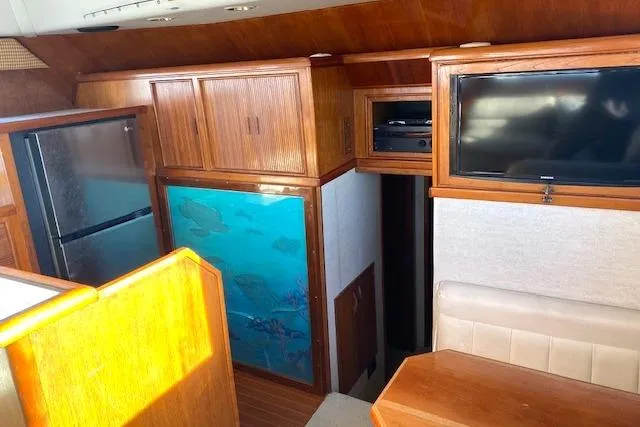 Slide: The Image of Interior of 1988 Buddy Davis 47 Custom Carolina yacht with wood cabinetry and modern amenities. - 18