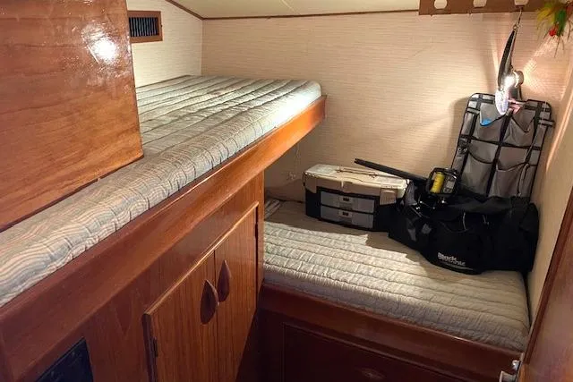 Slide: The Image of 1988 Buddy Davis 47 Custom Carolina cabin with bunk beds and storage. - 22