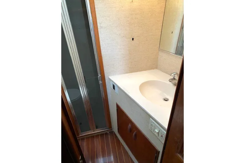 Slide: The Image of Bathroom interior of 1988 Buddy Davis 47 Custom Carolina yacht, featuring sink and shower. - 23